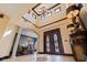 Grand foyer with high ceilings, decorative tile flooring, and double front doors at 3931 Pompano Se Dr, St Petersburg, FL 33705