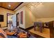 View of the home's game room with hardwood floors, foosball table, and recessed lighting at 3931 Pompano Se Dr, St Petersburg, FL 33705