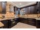 Gourmet kitchen featuring granite countertops, custom cabinets, and a stainless steel range at 3931 Pompano Se Dr, St Petersburg, FL 33705