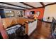 An upstairs landing with hardwood floors and a ornate wrought iron railing at 3931 Pompano Se Dr, St Petersburg, FL 33705