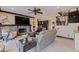 Cozy living room with stone fireplace, entertainment center and staircase at 3931 Pompano Se Dr, St Petersburg, FL 33705