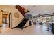 Large living area featuring an ornate staircase and view to the back yard at 3931 Pompano Se Dr, St Petersburg, FL 33705