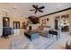 Open-concept living area with staircase, comfortable seating, a wet bar, and access to the outdoor living space at 3931 Pompano Se Dr, St Petersburg, FL 33705