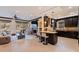 Open-concept kitchen and living room with a fireplace, granite countertops, and tiled floors at 3931 Pompano Se Dr, St Petersburg, FL 33705