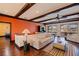 A living room with a beige couch, dark wood trim, and access to a balcony at 3931 Pompano Se Dr, St Petersburg, FL 33705