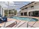 Stunning pool with spa and plenty of seating for entertaining outdoors at 3931 Pompano Se Dr, St Petersburg, FL 33705