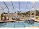 Enjoy the lanai with sparkling pool and serene waterfront views at 3931 Pompano Se Dr, St Petersburg, FL 33705