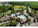 Aerial view of community center with pools, clubhouse, athletic fields, and mature trees at 4105 Waterville Ave, Wesley Chapel, FL 33543