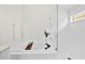 Modern bathroom features soaking tub, glass shower door, and updated fixtures at 4105 Waterville Ave, Wesley Chapel, FL 33543