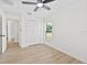 Neutral bedroom features a closet, window, and ceiling fan at 4105 Waterville Ave, Wesley Chapel, FL 33543