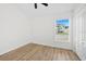 Bright bedroom with light-colored wood floors and a window that provides natural light at 4105 Waterville Ave, Wesley Chapel, FL 33543