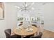 Modern dining room with views to living and kitchen areas at 4105 Waterville Ave, Wesley Chapel, FL 33543
