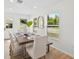 Bright dining area features a table set and natural light at 4105 Waterville Ave, Wesley Chapel, FL 33543