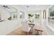 Open dining space with a large wood table and modern seating at 4105 Waterville Ave, Wesley Chapel, FL 33543