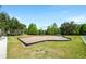 Enjoy the outdoors on this swing set with rubber mulch surrounded by a grassy green space at 4105 Waterville Ave, Wesley Chapel, FL 33543