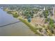 Panoramic aerial shot capturing the home's location near a park with a pier, blending residential comfort with outdoor amenities at 503 Chestnut St, Oldsmar, FL 34677