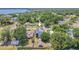Expansive aerial view of a home featuring solar panels with a spacious yard and proximity to waterfront views at 503 Chestnut St, Oldsmar, FL 34677