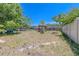 Large backyard with a charming gazebo, perfect for outdoor relaxation and entertaining guests at 503 Chestnut St, Oldsmar, FL 34677
