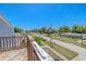 Spacious wooden balcony overlooking residential street with lush greenery at 503 Chestnut St, Oldsmar, FL 34677