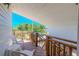 Charming balcony with wood railings and comfortable outdoor seating at 503 Chestnut St, Oldsmar, FL 34677