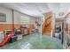 Spacious basement with wood paneling, a fireplace and stairs leading to the upper level, perfect for additional living space at 503 Chestnut St, Oldsmar, FL 34677