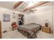 Bedroom with exposed beams, ceiling fan, and closet at 503 Chestnut St, Oldsmar, FL 34677