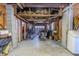 Spacious garage with concrete floor, exposed ceiling beams, and ample storage space perfect for a workshop or parking at 503 Chestnut St, Oldsmar, FL 34677