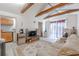 Open living space featuring wood beams and cozy seating area at 503 Chestnut St, Oldsmar, FL 34677