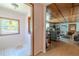 Inviting living room with wood-paneled ceiling, with views through to the entry at 503 Chestnut St, Oldsmar, FL 34677