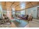 Spacious living room with paneled ceiling, ample seating, and bright natural light at 503 Chestnut St, Oldsmar, FL 34677