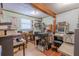 Well-lit office features wood floors, a window, and wooden support beams, great for working from home at 503 Chestnut St, Oldsmar, FL 34677