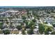 An aerial view shows a neighborhood with mature trees and convenient access to shopping and the bay at 5072 98Th Way, St Petersburg, FL 33708