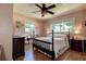 Bedroom featuring a traditional bed, hardwood floors, and bright natural light at 5072 98Th Way, St Petersburg, FL 33708