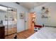 Bedroom featuring a daybed, wood floors, and a mirrored closet at 5072 98Th Way, St Petersburg, FL 33708