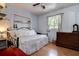 Cozy bedroom featuring a daybed, wood floors, and built in shelves at 5072 98Th Way, St Petersburg, FL 33708