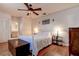 Relaxing bedroom with a ceiling fan, hardwood floors, and built in wardrobe at 5072 98Th Way, St Petersburg, FL 33708