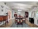 Traditional dining room with wood floors, bright windows, and elegant chandelier at 5072 98Th Way, St Petersburg, FL 33708