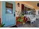 Charming front porch with seating, a decorative door, and vintage-inspired details at 5072 98Th Way, St Petersburg, FL 33708