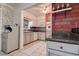 Stylish kitchen with grey cabinetry, granite countertops, and stainless steel appliances at 5072 98Th Way, St Petersburg, FL 33708