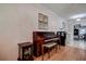 Warm piano room featuring wood floors, a piano and vintage decorations at 5072 98Th Way, St Petersburg, FL 33708