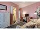 Office features a desk, a floral sofa, and a laundry room access at 5072 98Th Way, St Petersburg, FL 33708
