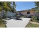 The backyard patio includes an outdoor table and chairs, all fenced in for added privacy at 5072 98Th Way, St Petersburg, FL 33708