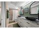 Bathroom with double sinks, granite countertops, and glass shower at 5537 Sea Forest Dr # 304, New Port Richey, FL 34652