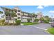 Beautiful multi-story condominium building showcasing well-maintained grounds and ample parking at 5537 Sea Forest Dr # 304, New Port Richey, FL 34652