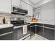 Updated kitchen featuring modern appliances, light countertops, contrasting cabinets, and stylish backsplash at 5537 Sea Forest Dr # 304, New Port Richey, FL 34652