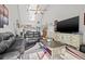 Bright living room with high ceilings, comfortable seating, and a view into the open-concept kitchen at 5537 Sea Forest Dr # 304, New Port Richey, FL 34652