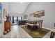 Spacious living space featuring dining and sitting area with vaulted ceiling and plenty of natural light at 5537 Sea Forest Dr # 304, New Port Richey, FL 34652