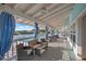 Comfortable outdoor patio area with beautiful water views and stylish wicker furniture at 5537 Sea Forest Dr # 304, New Port Richey, FL 34652