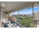 Relaxing screened porch with seating area and scenic neighborhood views at 5537 Sea Forest Dr # 304, New Port Richey, FL 34652