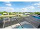 Screened-in pool offers canal views, docks, and lush landscaping at 6509 Dolphin Cove Dr, Apollo Beach, FL 33572